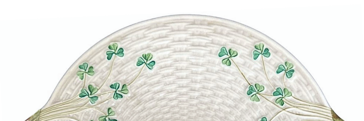 Belleek Shamrock cake plate showcasing Ireland's iconic three-leaf clover design and signature cream finish. A beautiful example of Parian porcelain.