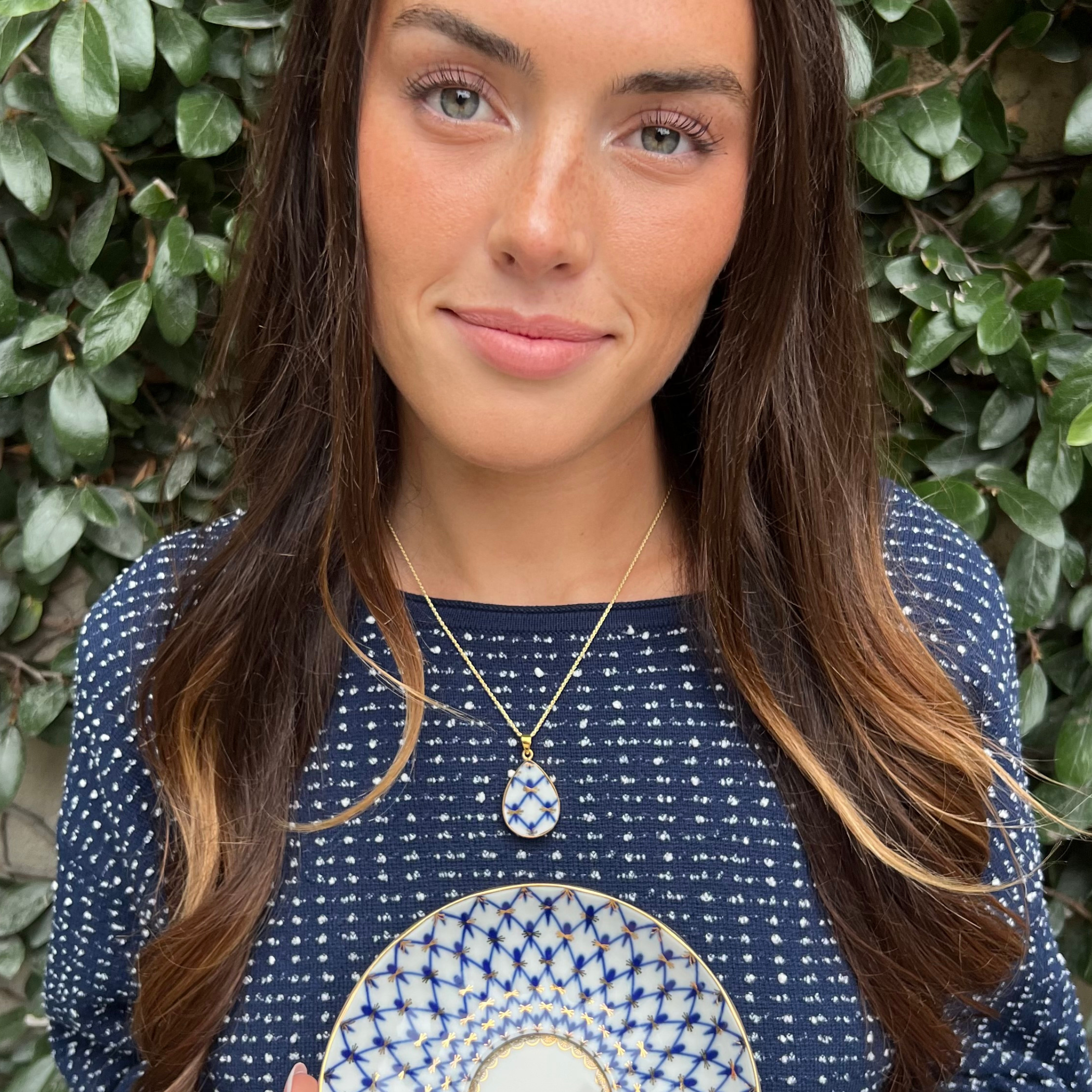 Woman wearing handmade elegant Russian Lomonosov porcelain necklace with vintage-inspired styling