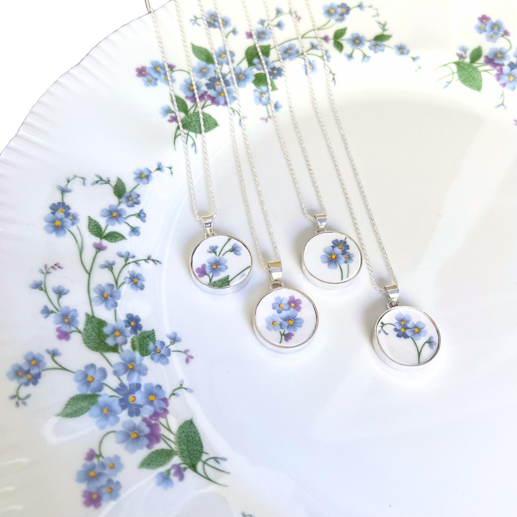 Four romantic forget-me-not necklaces with sterling silver, handmade from vintage Paragon china - perfect for anniversaries, birthdays, or memorials.