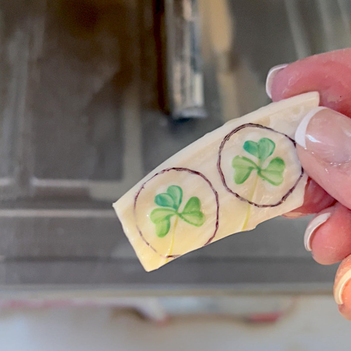 A cut piece of vintage Belleek Shamrock porcelain, ready to be shaped to make Irish broken china jewelry perfect for St. Patrick's Day