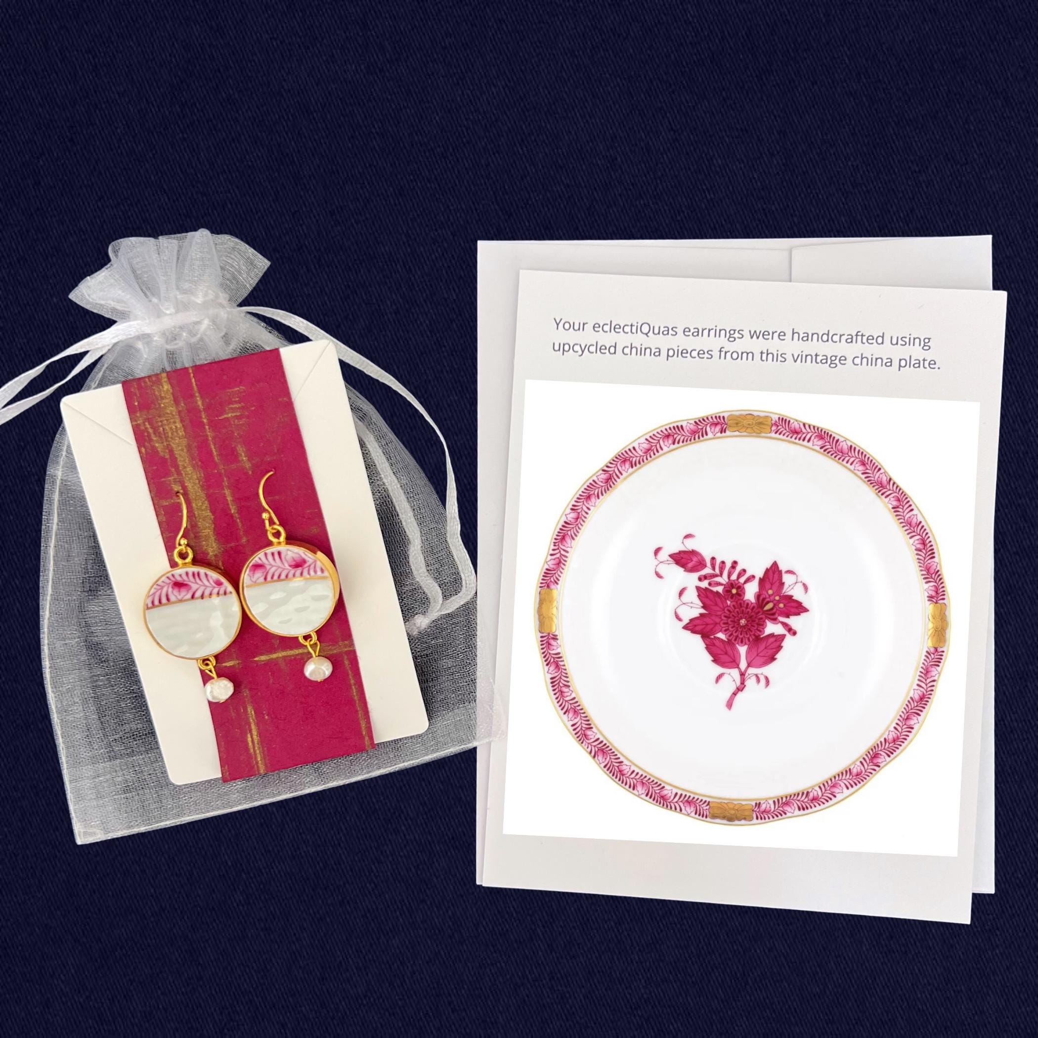 Herend Chinese Bouquet Raspberry earrings on a white organza jewelry bag with a photo card of the china plate from which the earrings were made.