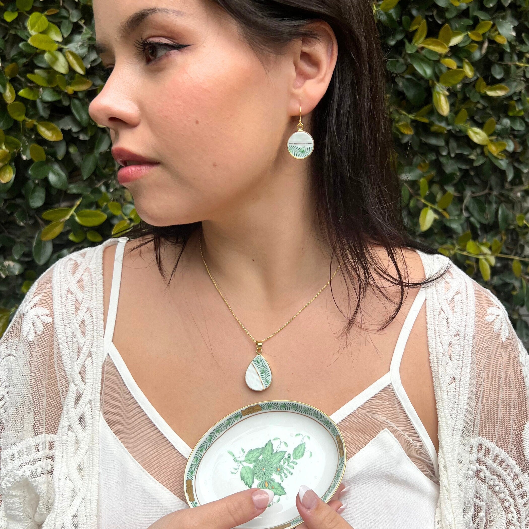 Model wearing a vintage Green Herend Chinese Bouquet China Necklace & Earrings, and holding a matching ring dish