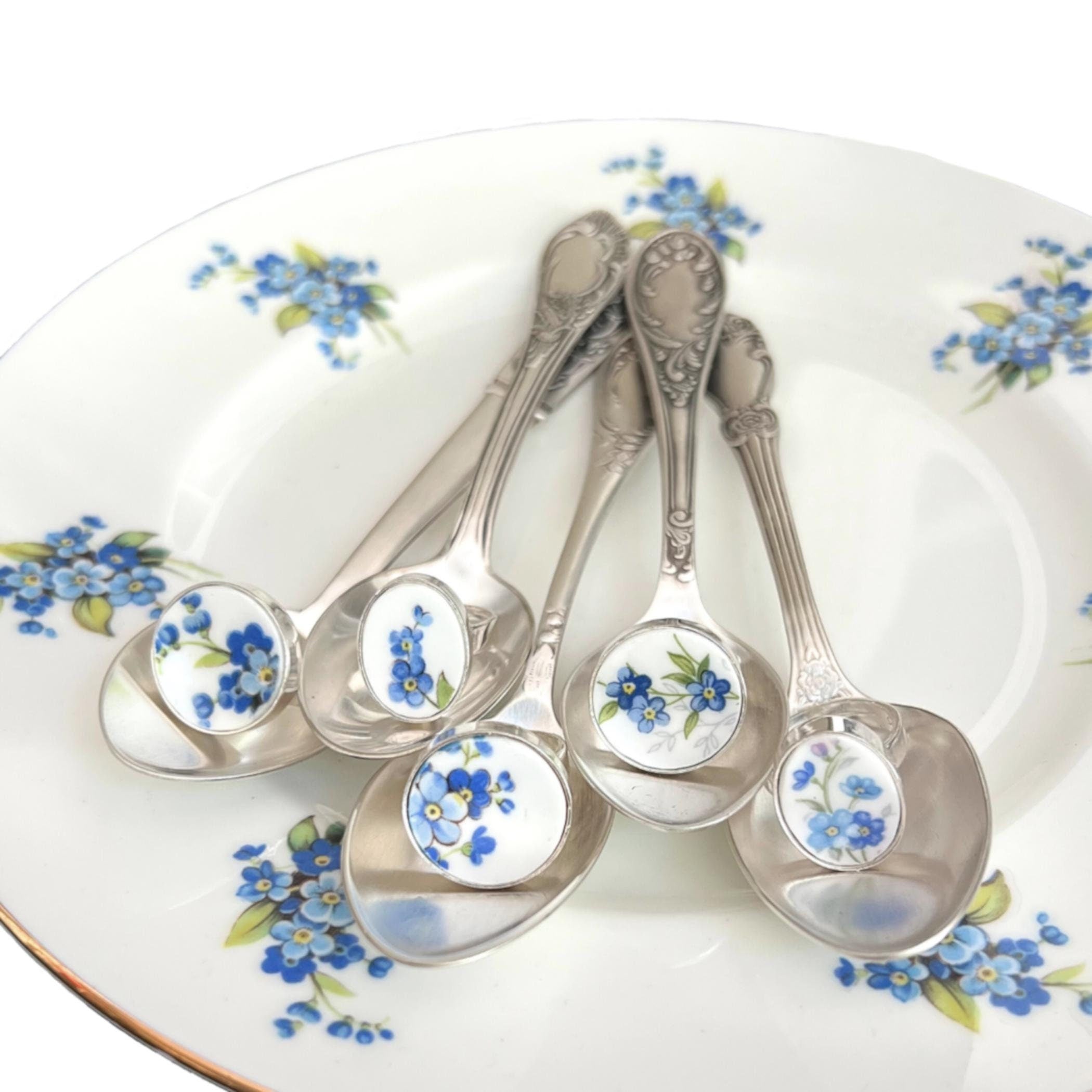 Handmade sterling silver adjustable rings featuring blue forget-me-not flowers from antique Royal Albert and Queen Anne china plates