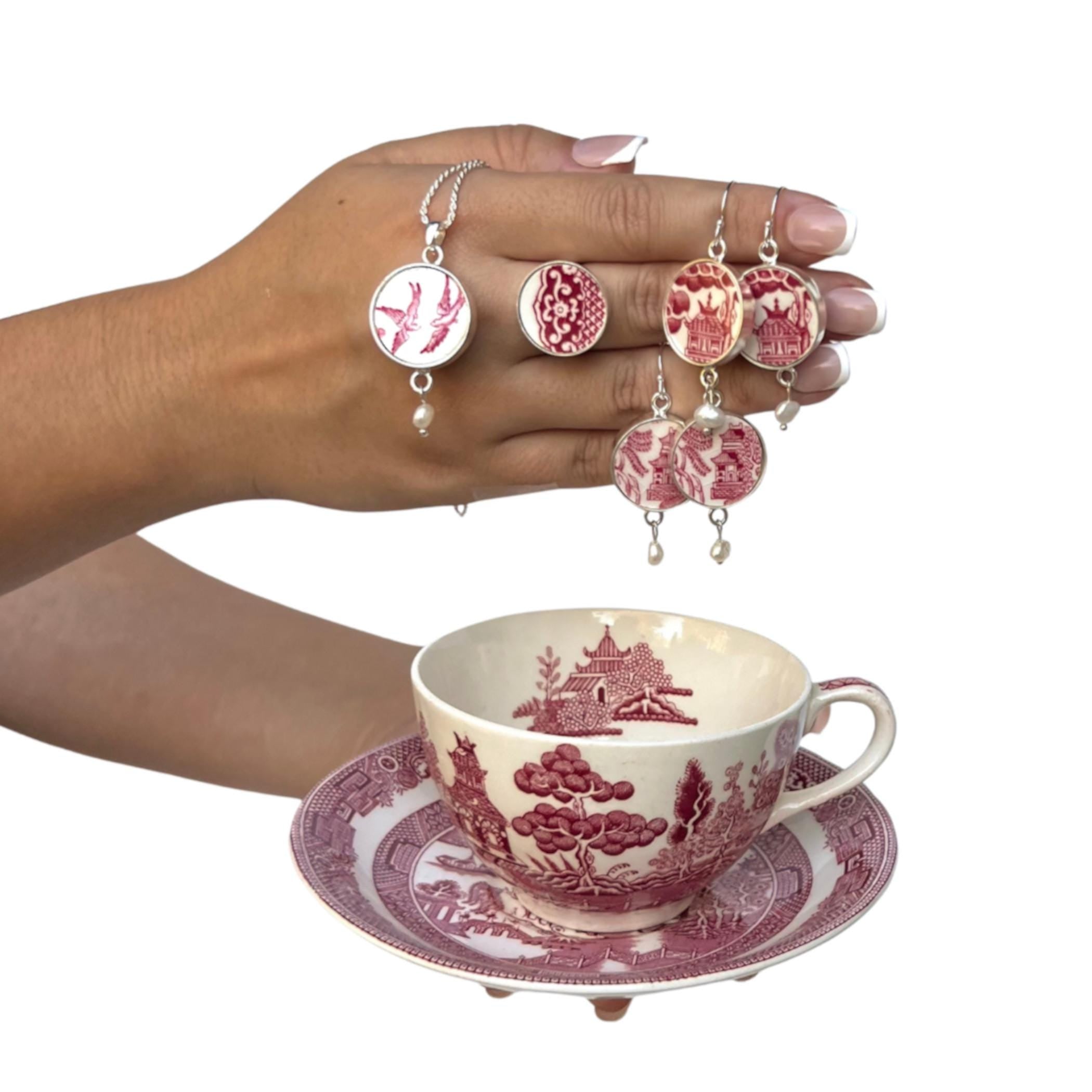 Handcrafted collection featuring vintage Red Willow bone china teacup and saucer with matching upcycled Love Birds china necklace, ring and pagoda earrings