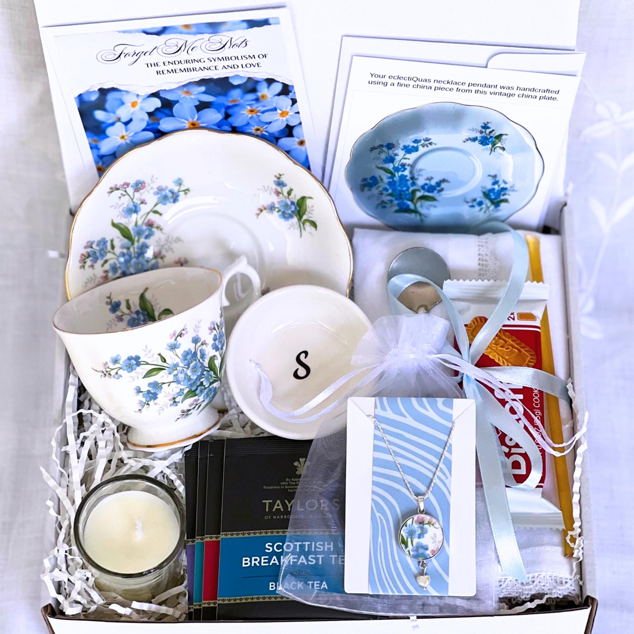Tea gift basket with vintage forget-me-not china cup & saucer, gourmet teas, and optional matching jewelry - a thoughtful Mother's Day gift with memorable charm