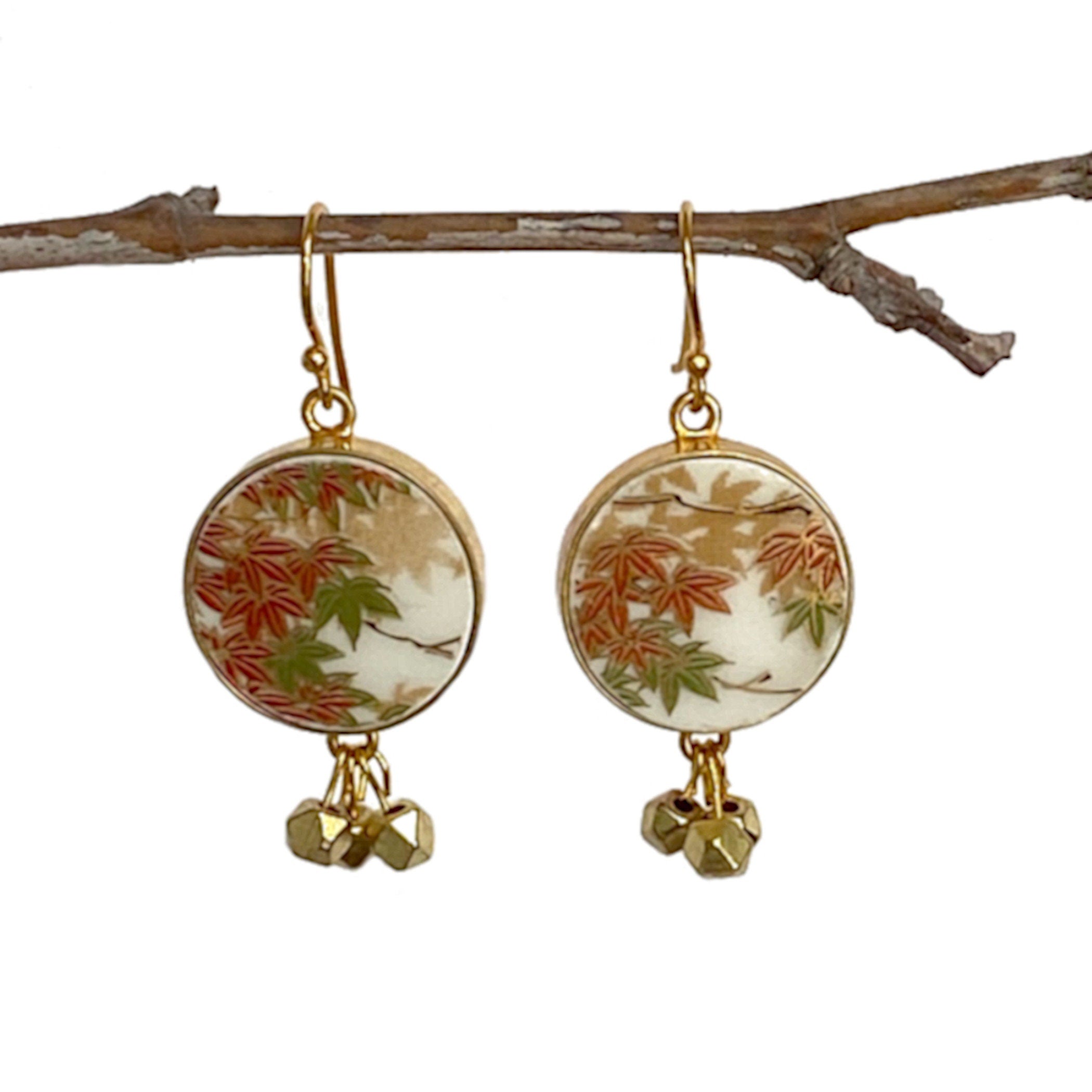 Autumn Leaf Broken China Earrings, featuring clusters of dangling gold faceted beads, gold plated sterling silver settings and findings, and repurposed china pieces from an antique Japanese Yamaji china plate.