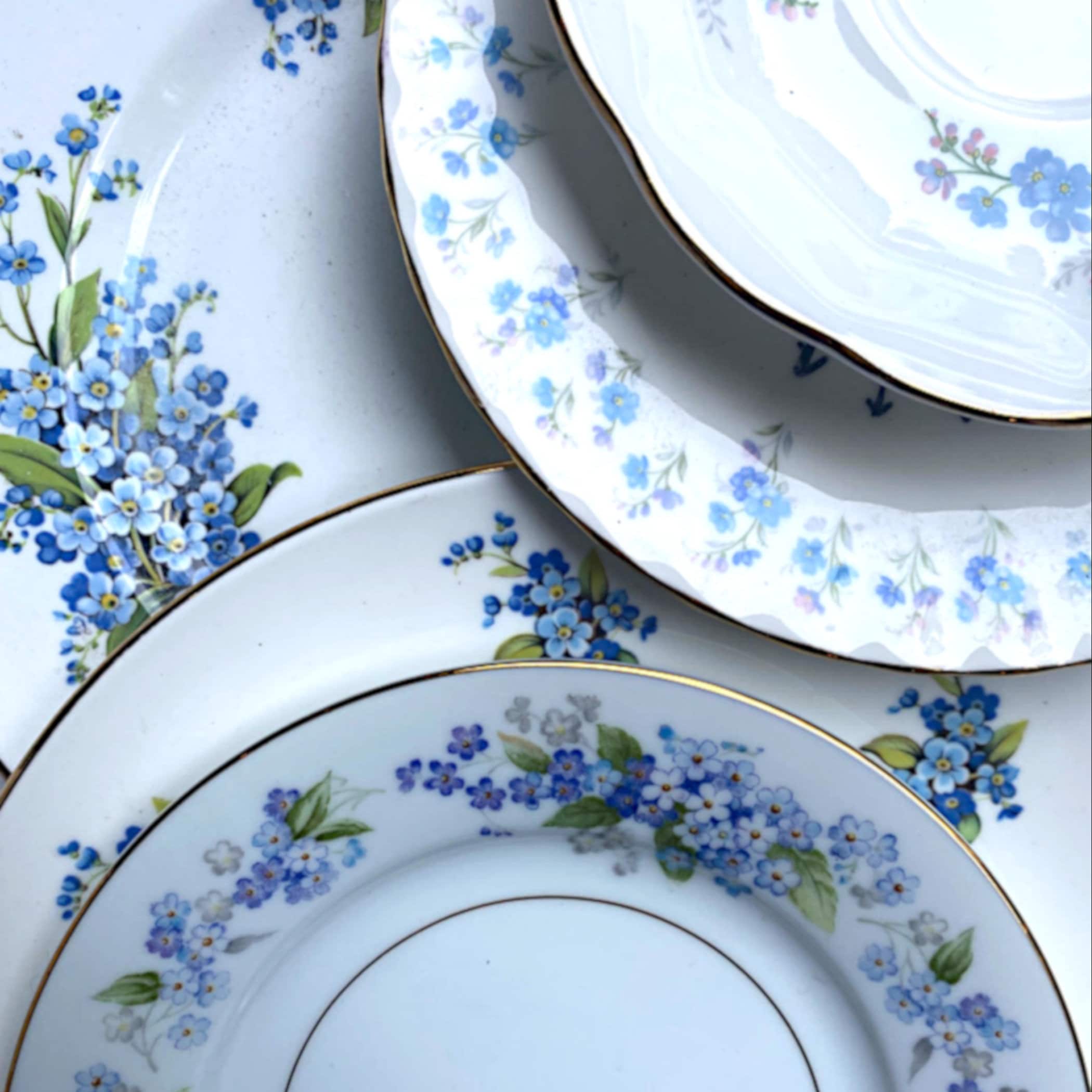 Photo featuring the beautiful forget me not vintage porcelain and antique bone china plates used in eclectiQuas broken china jewelry.