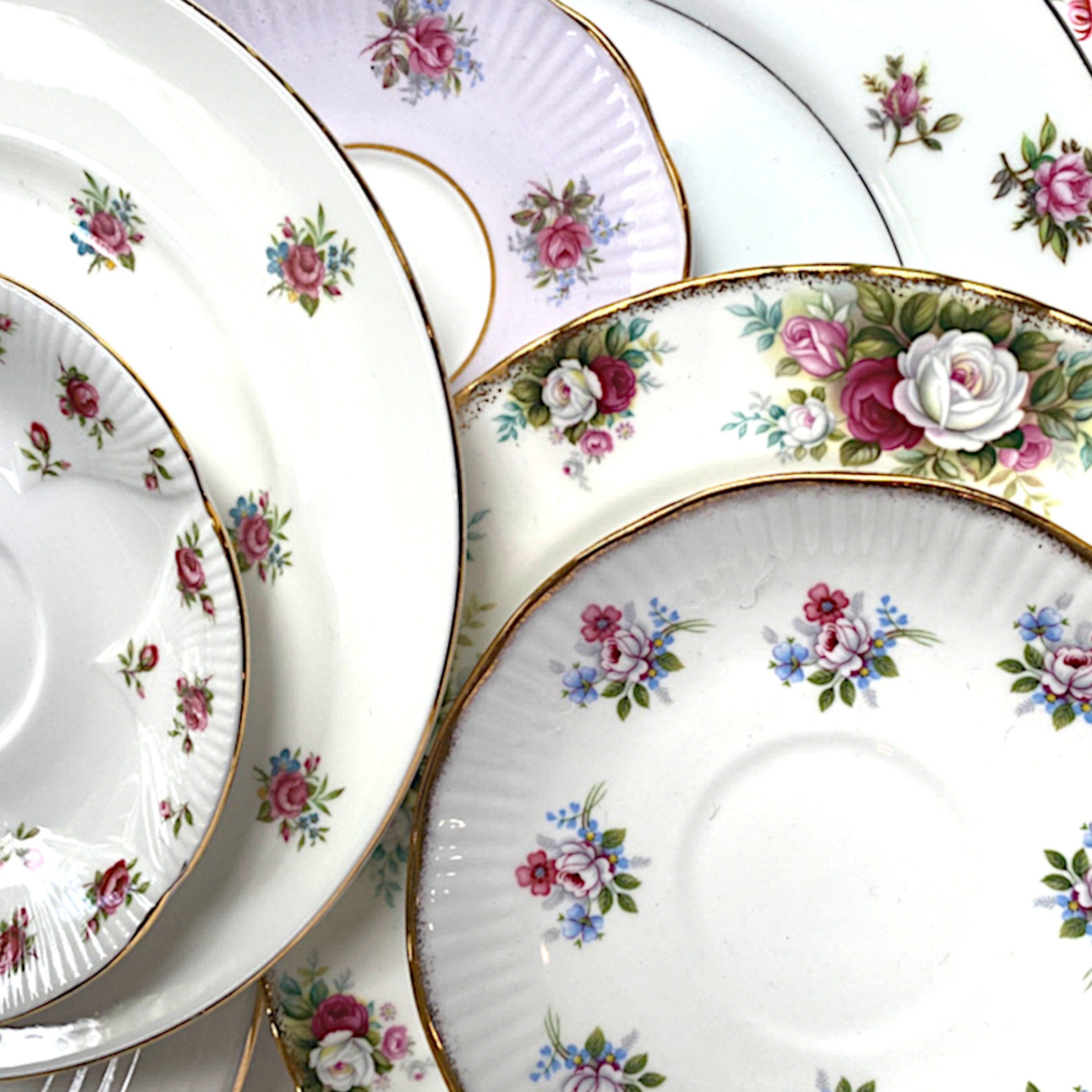 Photo featuring the beautiful rose vintage porcelain and antique bone china plates used in eclectiQuas broken china jewelry.