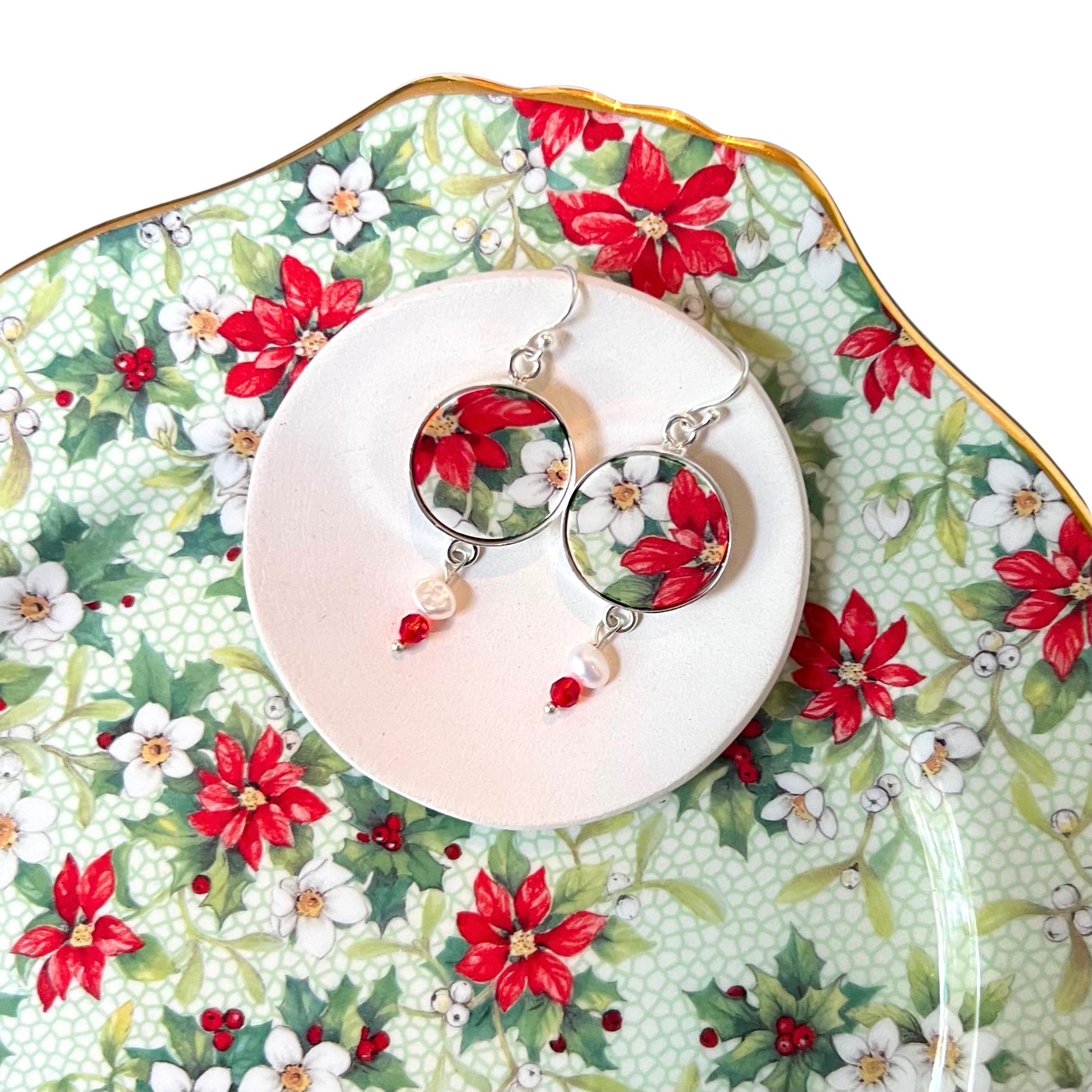 Red poinsettia earrings made from vintage Royal Winton china with sterling silver, pearls and Swarovski crystals