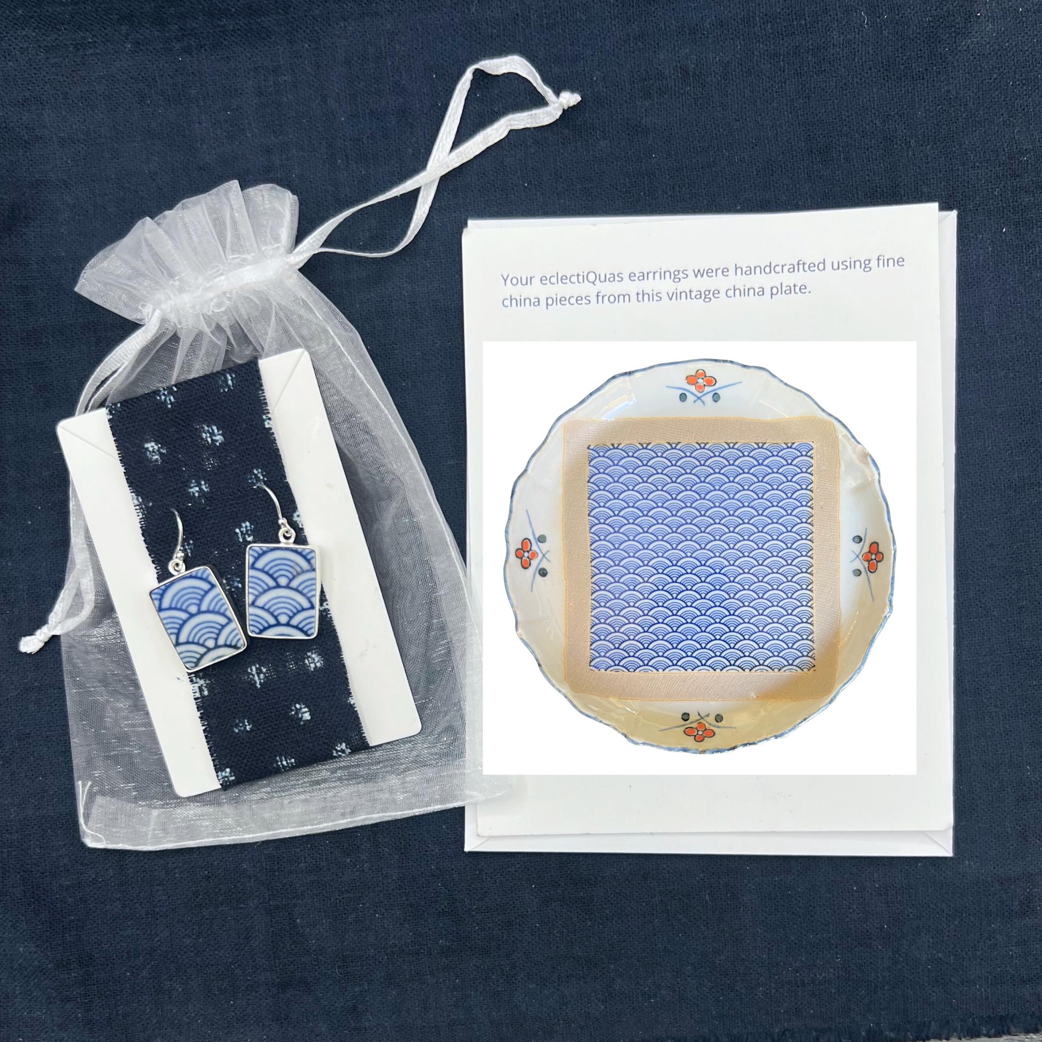 eclectiQuas jewelry packaging with porcelain earrings and a photo card of the vintage porcelain plate it’s handcrafted from
