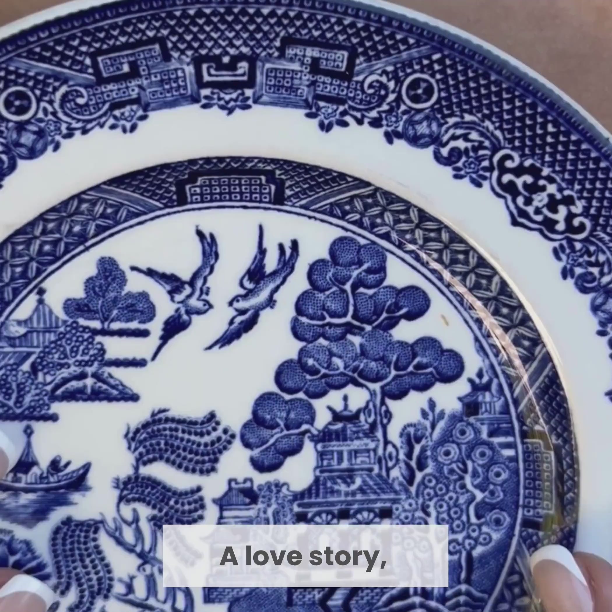 A love story, told in Blue Willow. Two love birds, forever together. Inspired by a legendary tale of true love. Handcrafted from vintage Blue Willow china. A beautiful symbol of love and devotion." Video shows the Blue Willow china plate and the Love Birds necklace being worn, with shots of the necklace and plate from different angles.