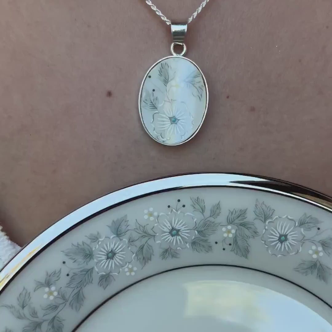 Video of a young woman modeling a broken china necklace handmade with Vintage Lenox Windsong China & Sterling Silver