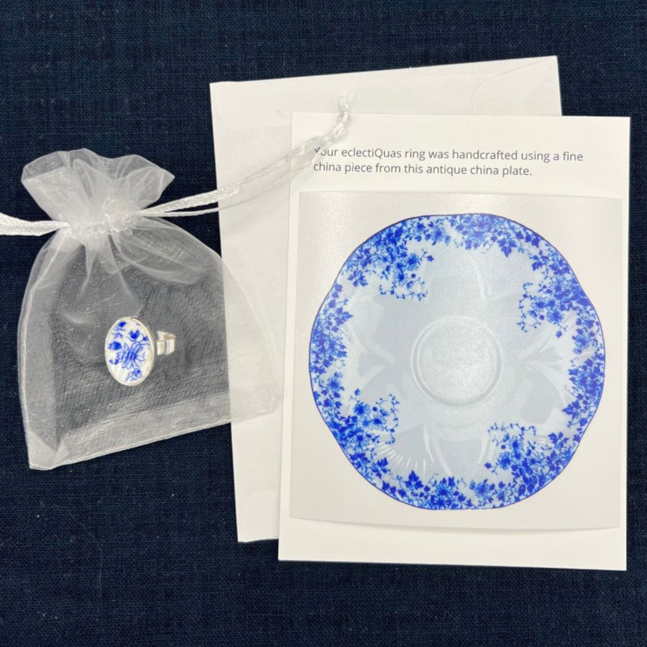 Vintage Dainty BluShelley Dainty Blue adjustable china ring on a white organza jewelry bag with a photo card of the china plate they were made from.