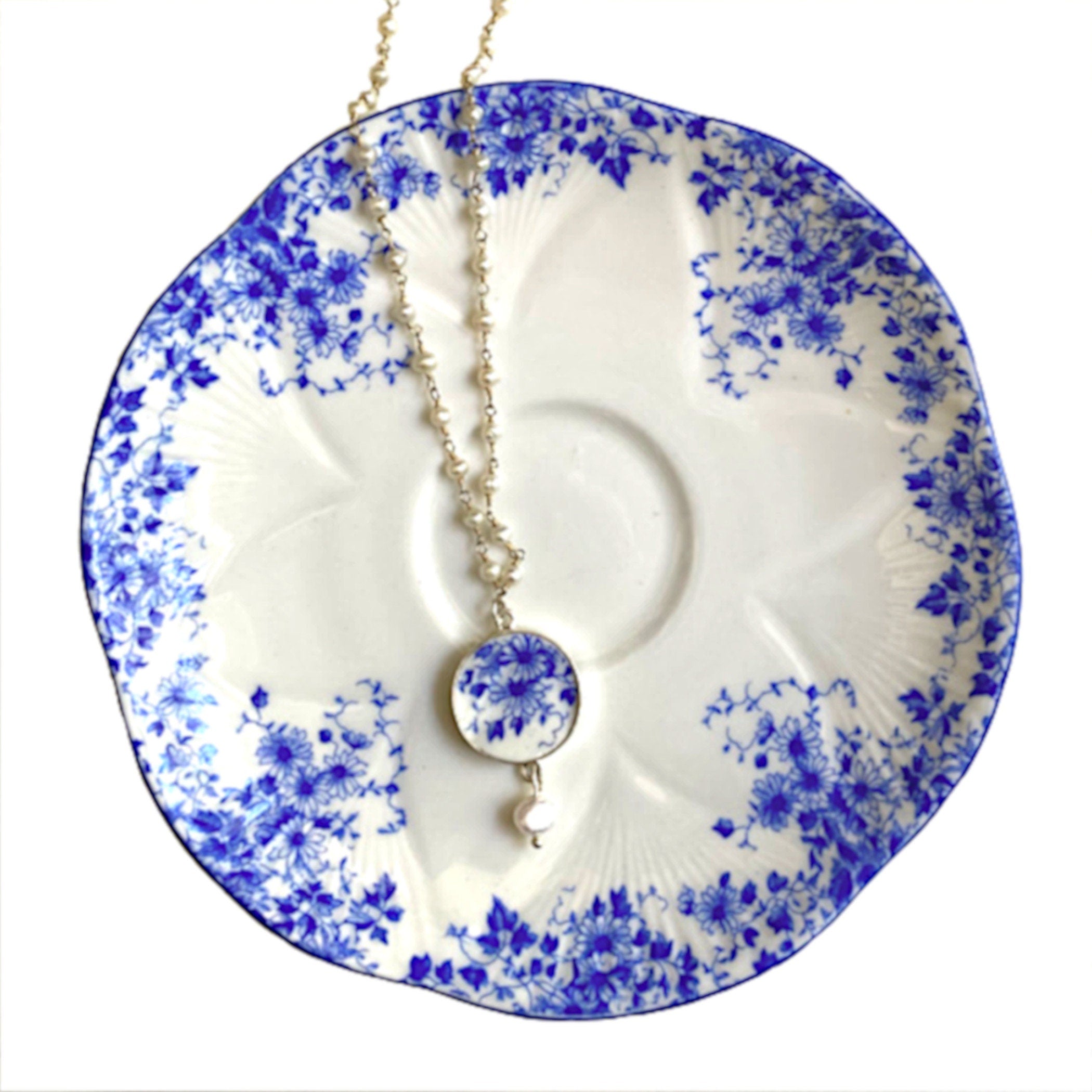 Shelley Dainty Blue china jewelry displayed on the matching vintage plate.