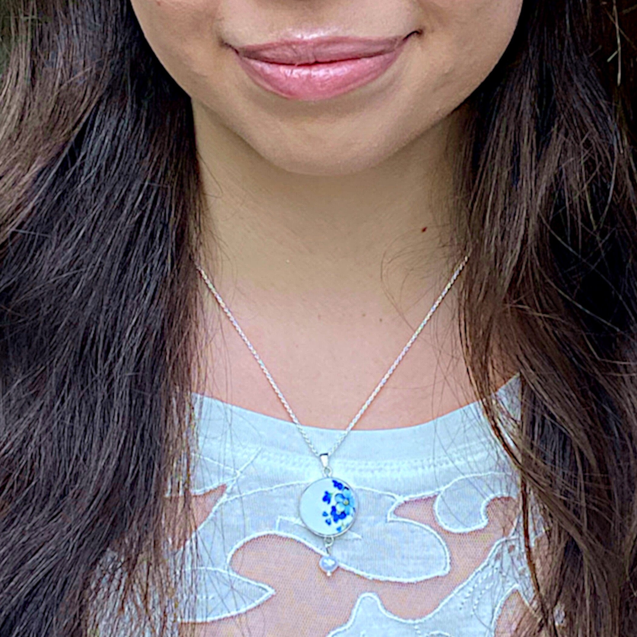 Model wearing this Forget Me Not Broken China Necklace sterling silver rope chain and forget me not pendant.