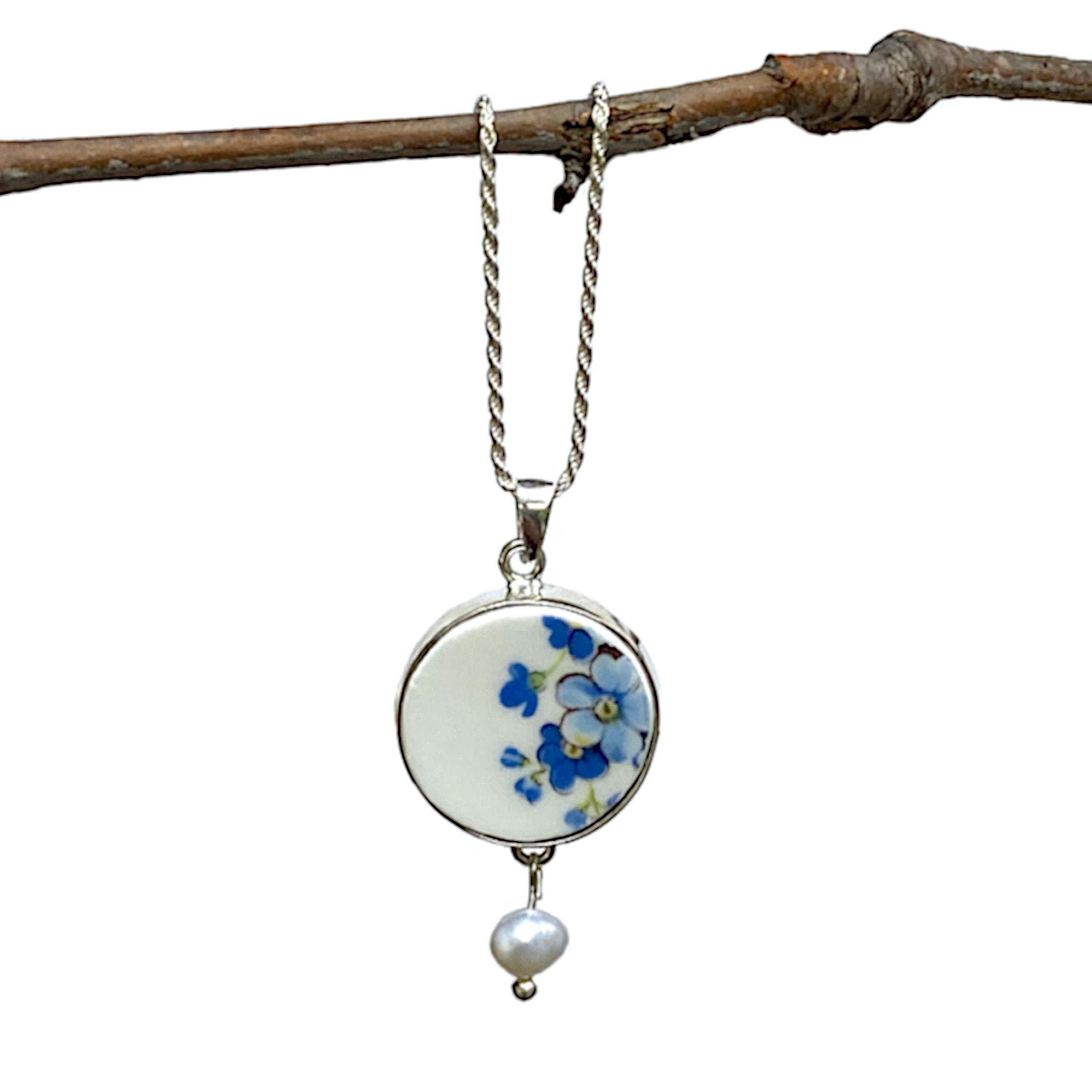 Forget Me Not China Necklace, a sterling silver diamond cut rope chain in 18in or 20in, and a repurposed china piece from a vintage Regency Forget Me Not china plate.